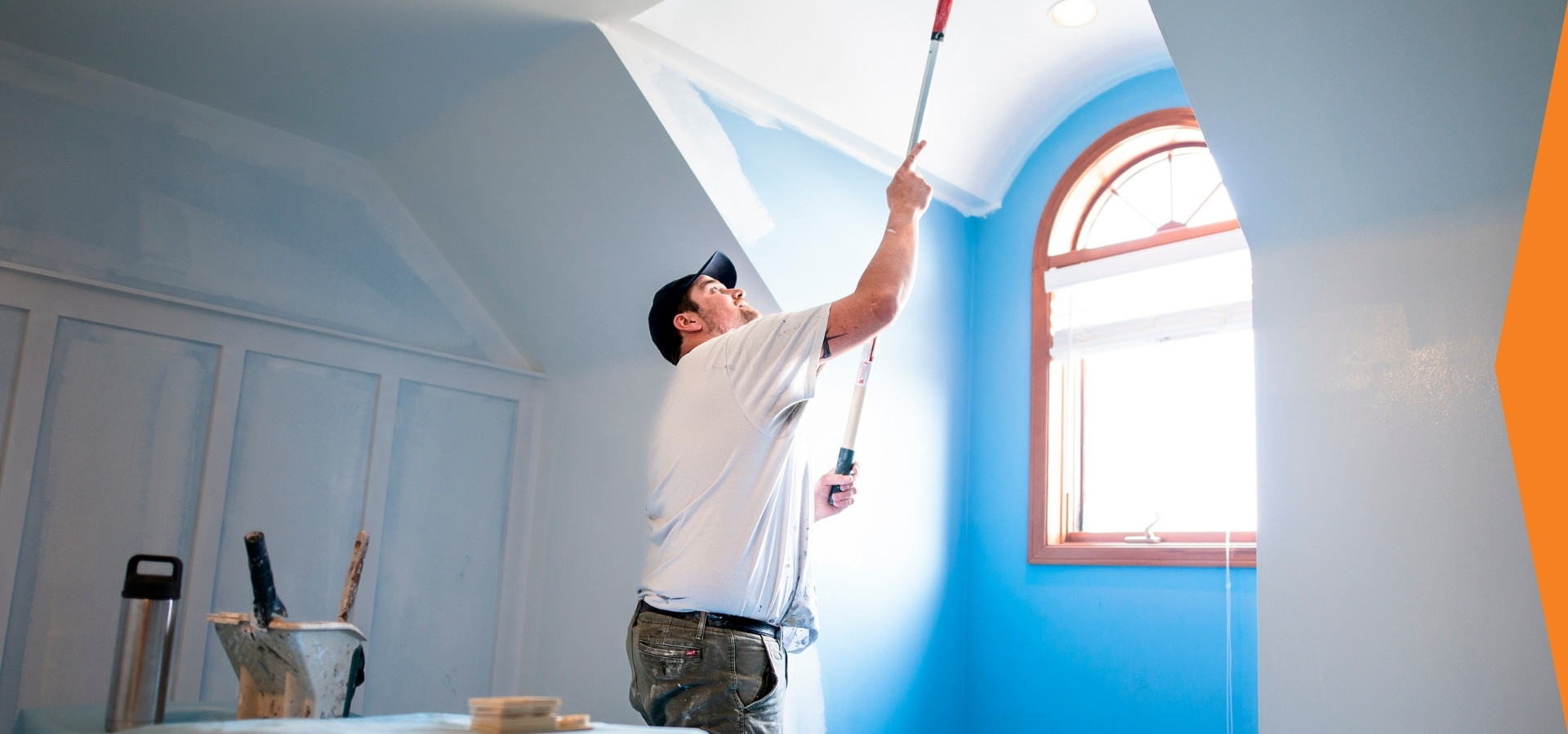 Supreme Handyman Painting a Ceiling