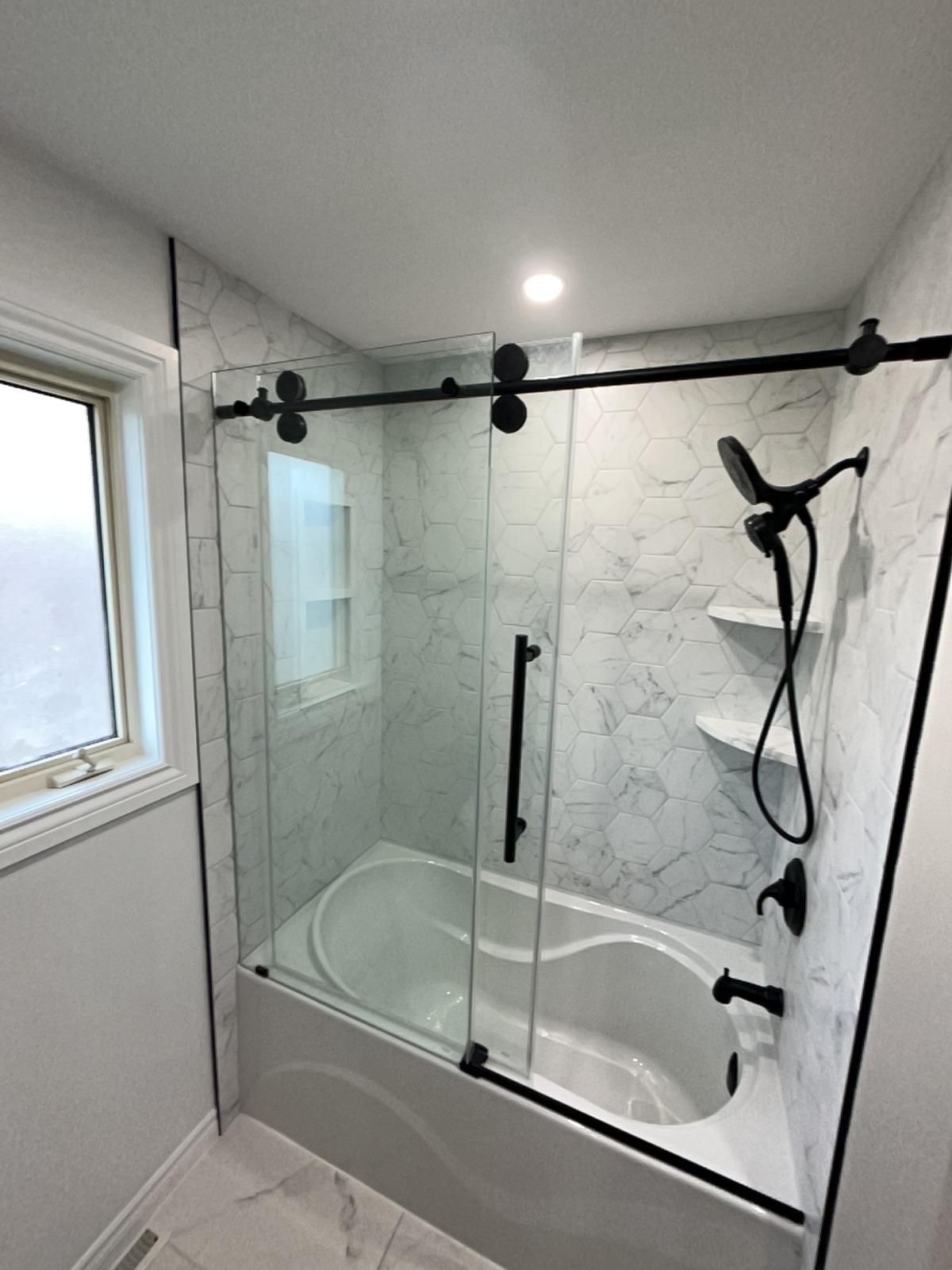 a bathroom shower and tub